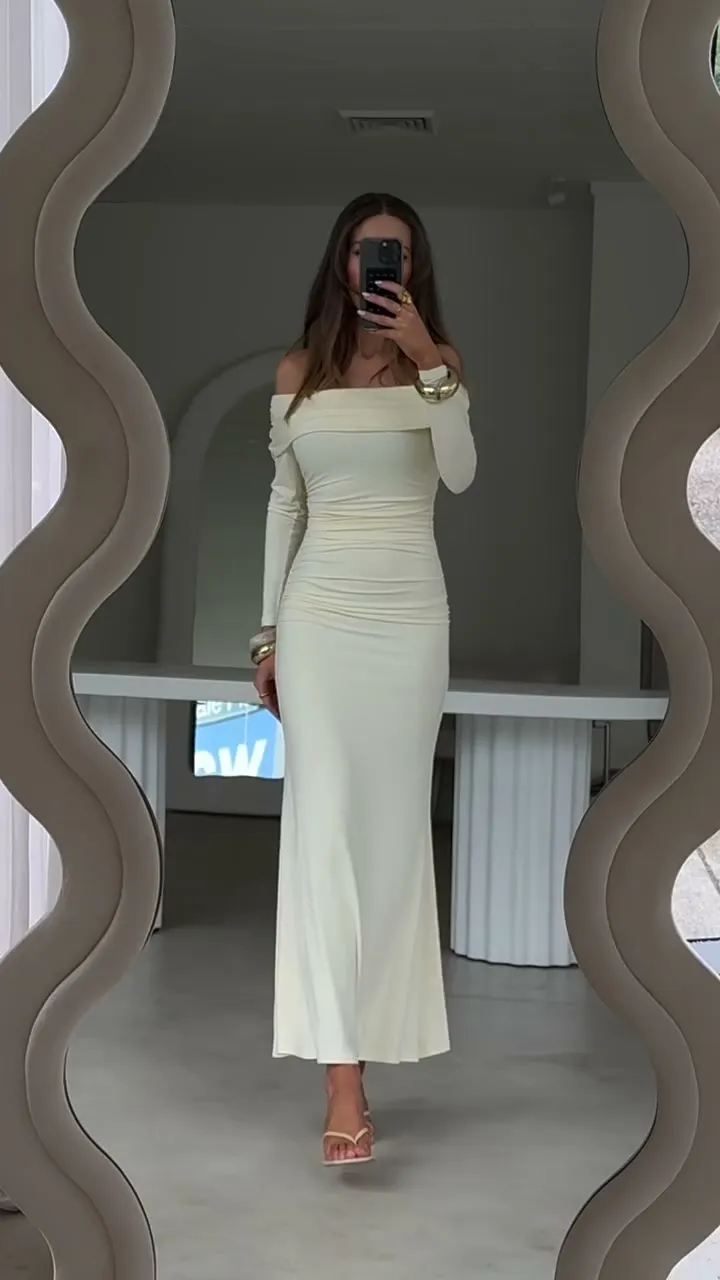 Nataša Milisic in a cream MODI look framed by a sculptural mirror