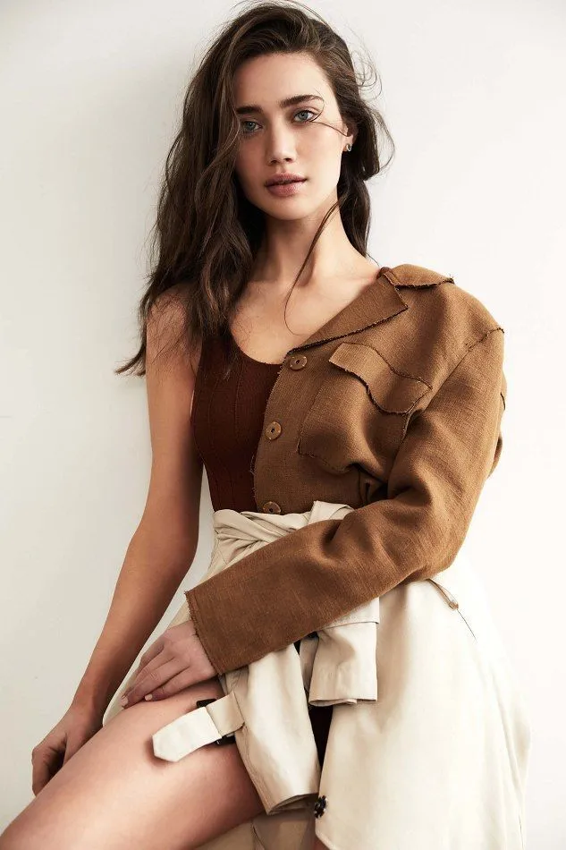 Nataša in a deconstructed brown and ivory editorial look