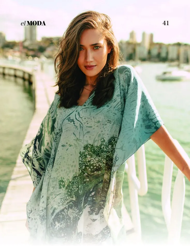 El MODA page 41 showing Natasha Milisic in a green patterned dress beside a white waterfront railing